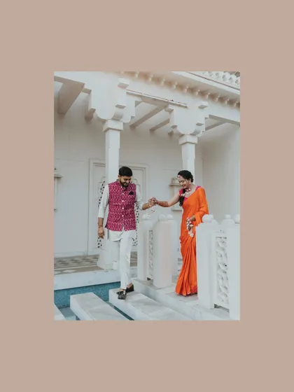 A romantic shot of the couple at their destination Haldi, framed by the beautiful architecture of the venue. A quiet moment amidst the joyful chaos.
