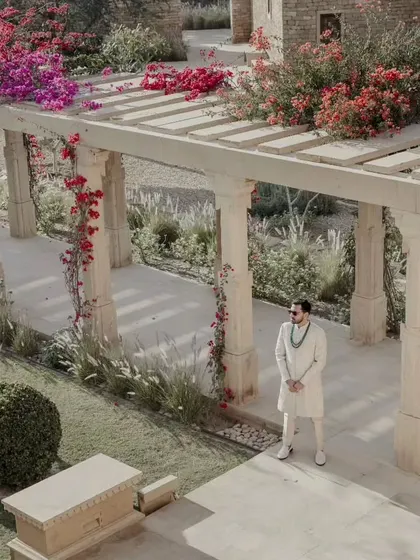 A quiet moment for the groom amidst the beautiful architecture and bougainvillea-laden pergolas of Suryagarh. We ensure our couples have moments of calm to soak in the beauty of their surroundings.