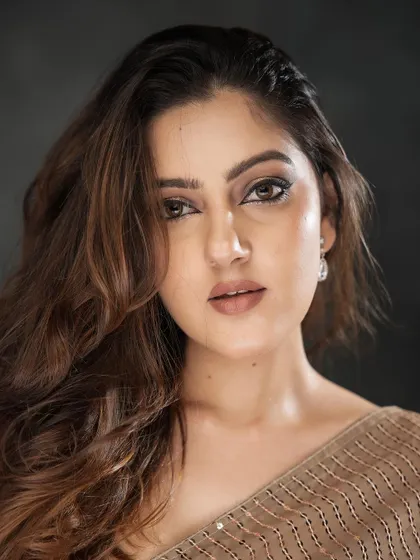 A stunning portrait where the makeup enhances the model's natural beauty. The focus is on the eyes, with a soft, neutral palette that makes them pop.