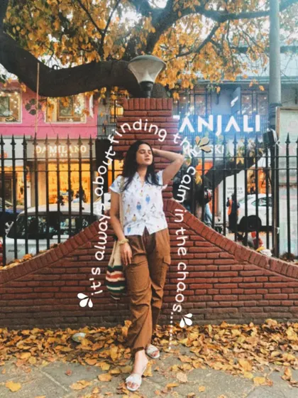 Another look at my calm-in-the-chaos outfit. The earthy tones of the brown cargo pants and the fallen leaves create a perfect autumn aesthetic.