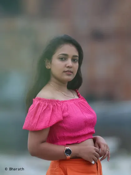 A simple and beautiful outdoor portrait. The soft lighting and direct gaze create a connection with the viewer.