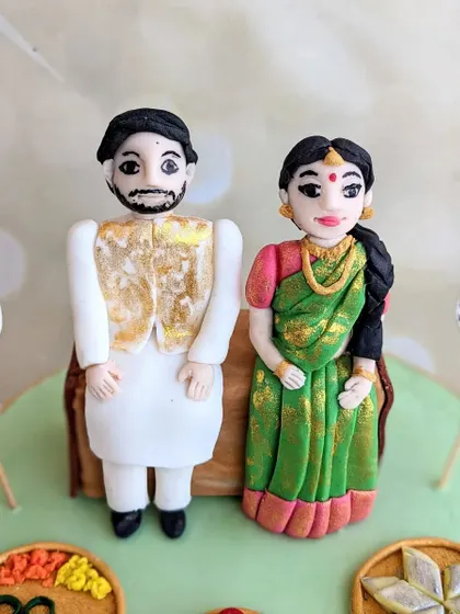 A close-up of the handcrafted fondant couple for the traditional baby shower cake. I love adding small details like the texture on the saree and the gold on the vest.