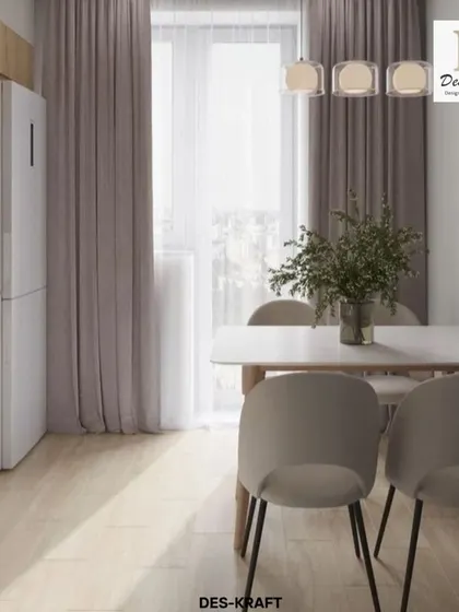 The kitchen and dining area are bathed in natural light from the large window, making the small space feel bright and open.