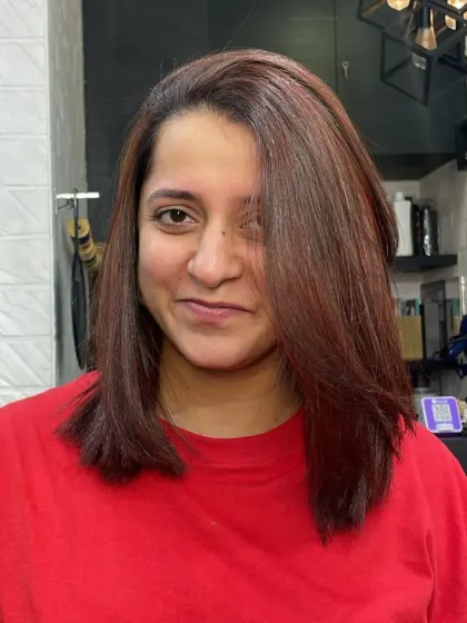 A fresh and energetic look. This client's new shoulder-length cut with a rich auburn color is a bold and beautiful transformation.