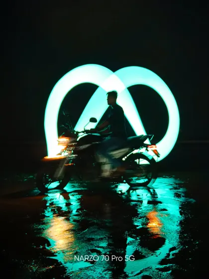 An infinity loop created with a light tube behind a motorcycle. This shot demonstrates another creative technique for night photography.
