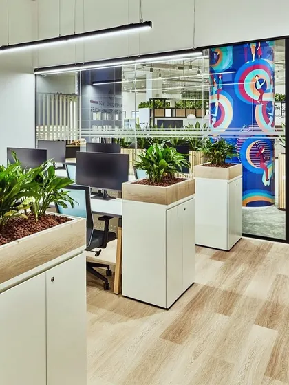 We designed these custom cabinet-top planters for an office space. They add a touch of green to each workstation without taking up valuable desk space, promoting a healthier work environment.