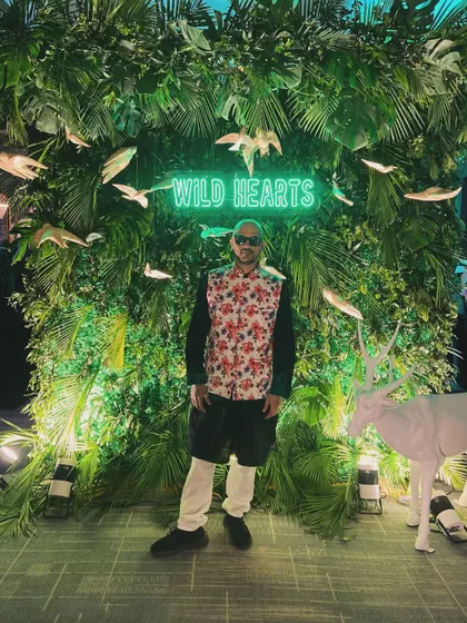 A final pose in the neon jungle. It's all about bringing good vibes and staying true to the party's spirit. Ready to get behind the decks.