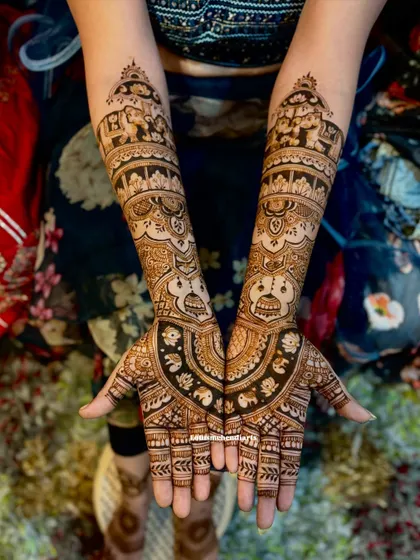 A majestic Ambari elephant design, a popular choice for South Indian brides, symbolizing royalty and celebration. The fine lines and shading bring the motif to life.