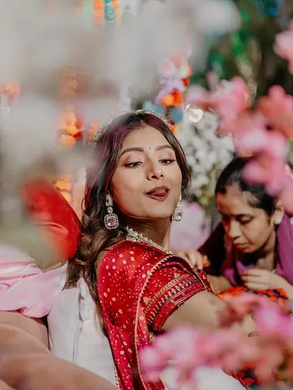 Another fun and playful shot of the bride, capturing her personality during the Mehendi application.