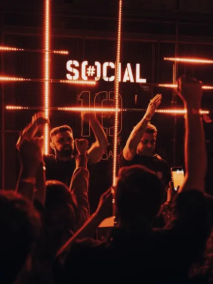 A triumphant shot with me and Stoked, hands in the air, celebrating a successful set with the crowd.