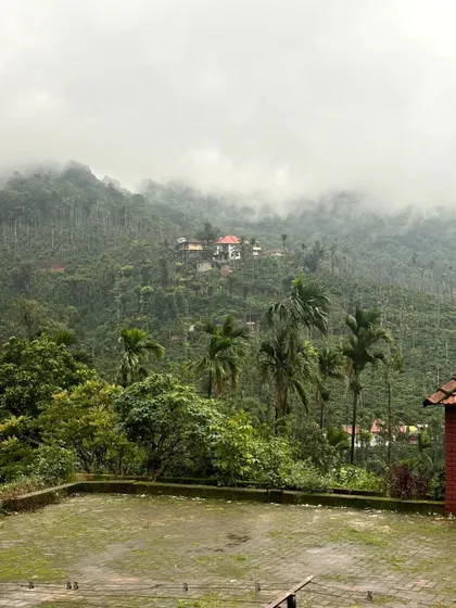 The misty view of our homestay, nestled in the hills.