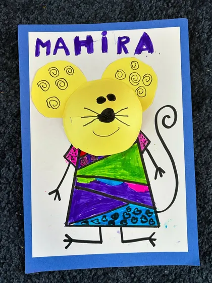 Mahira's mouse, proudly showing her name. The mix of purple, green, and blue is lovely.