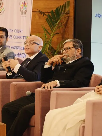 Deep in discussion at a legal aid seminar. Every case, whether paid or pro bono, receives the same meticulous attention to detail and fearless representation.