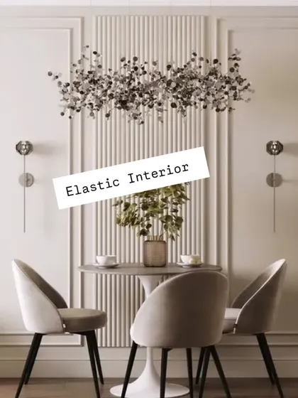 A beautiful dining nook with wall molding and fluted paneling as a backdrop. The design is simple yet sophisticated, creating a perfect frame for the small dining set.