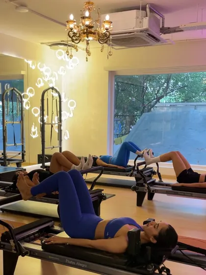 Hot girl Pilates is powered by self-love and a strong core. This synchronized leg press on the reformer feels amazing in a group class.