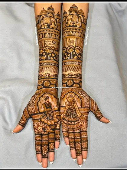 A mesmerizing bridal design featuring royal elephants, grand palaces, and beautiful peacocks. The palms are dedicated to portraits of the bride and groom, creating a perfect blend of tradition and love.