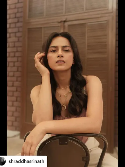 A closer portrait of Shraddha, focusing on the beautiful details of the layered necklaces and her confident, direct gaze.