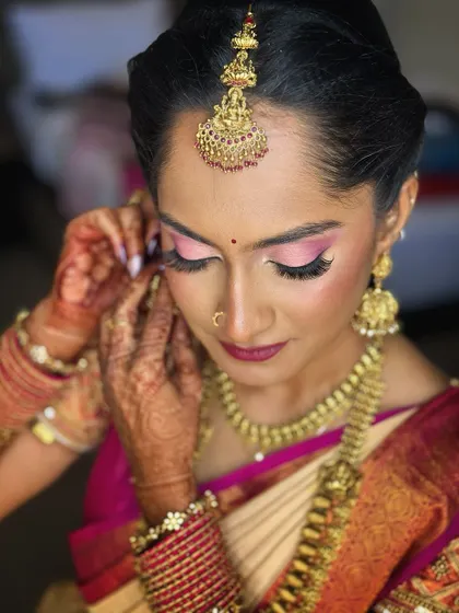 A close-up of the engagement makeup. The shimmering pink eyeshadow and fluttery lashes make her eyes pop, while the skin remains dewy and flawless.
