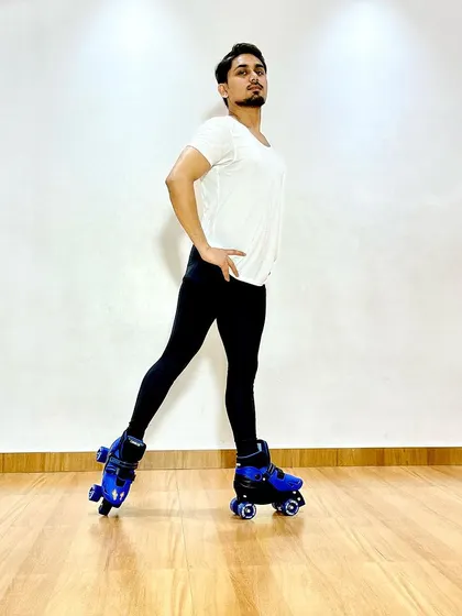 A duplicate of image 97, showing a confident pose on wheels.