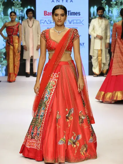 From our fashion week collection, this piece was born from a traditional Patola saree. I reimagined it as a center-pleat lehenga, using zardosi embroidery with a unique flamingo concept to add a layer of modern artistry.