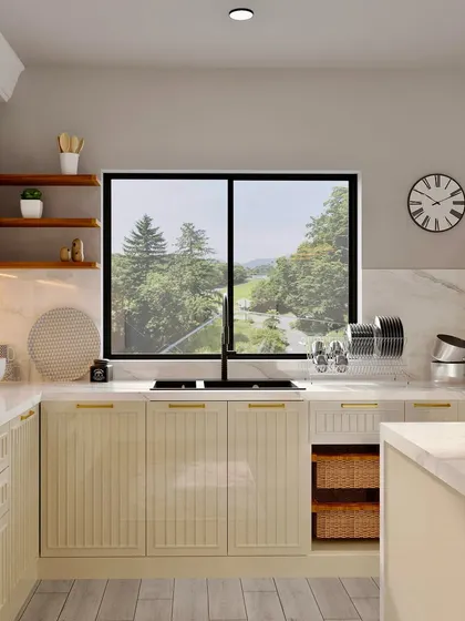 A closer look at the sink area of the cream-colored kitchen, showcasing the black faucet and the practical layout.