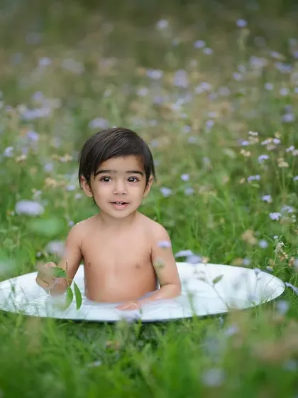 We can even take our milk bath sessions outdoors. This portrait, taken in a field of wildflowers, has a wonderfully natural and serene feel.