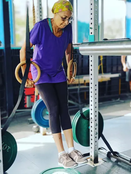 It's never too late to build strength. This member works on a supported ring dip, a great way to scale the exercise and build confidence.