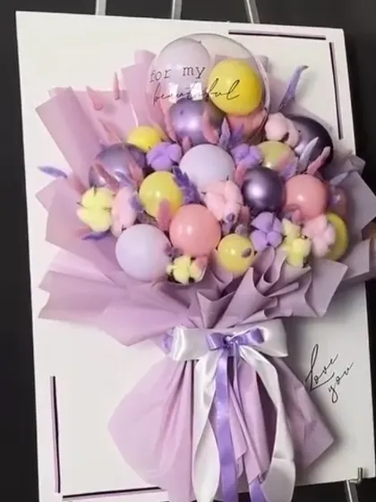 Why give a card when you can give a bouquet card? This unique creation mounts a pastel-colored balloon bouquet onto a large card, which can be personalized with a handwritten message.