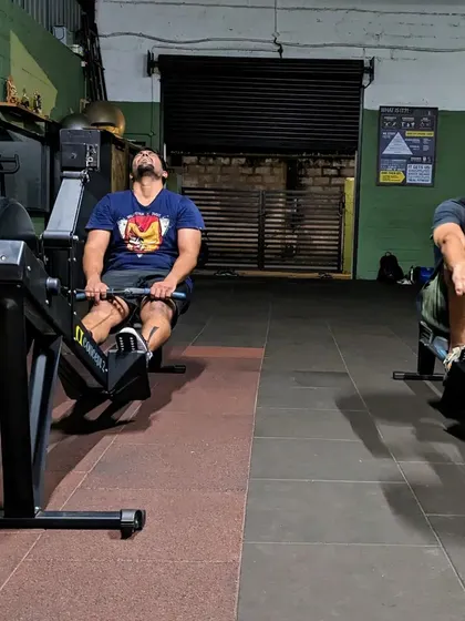 The two faces of a tough rowing workout: pure exhaustion and pure joy. We push our limits together and have fun doing it.