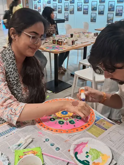Teamwork makes the dream work, even in art. Here, colleagues are collaborating and helping each other with their Lippan art designs. It’s a natural and effective way to encourage team bonding.