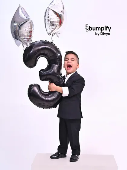 Turning three is a big deal! I love matching the energy of a child's milestone birthday with a fun, dynamic studio photoshoot. This little man is celebrating in style, full of personality and excitement.