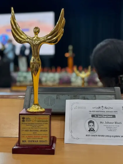 The Dr. Ajmer Singh Best Coach Award trophy and certificate from the 7th PEFI National Awards. This honor motivates me to continue my work in developing grassroots basketball.