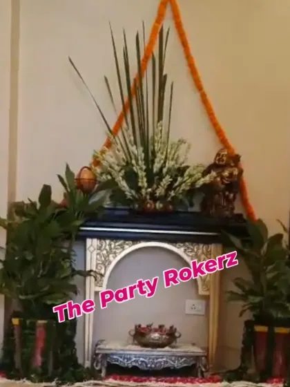 A corner of a home decorated for Teej, featuring a small mandir setup with tuberose arrangements and marigold garlands.
