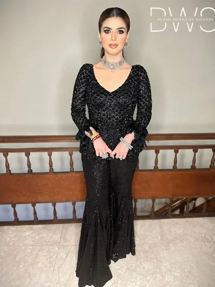 A full-length view of the client's reception look, with a sleek high ponytail that adds a touch of modern glamour.