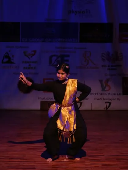 A moment of drama and poise in a solo classical dance.