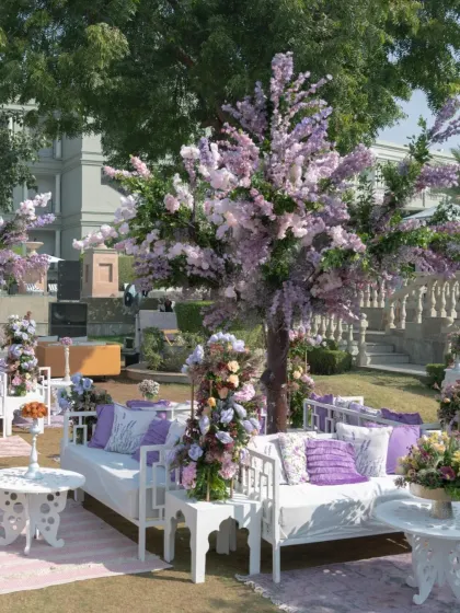 Another view of the lavender-themed lounge area, showcasing the lush, custom-made floral trees that were a highlight of the decor.