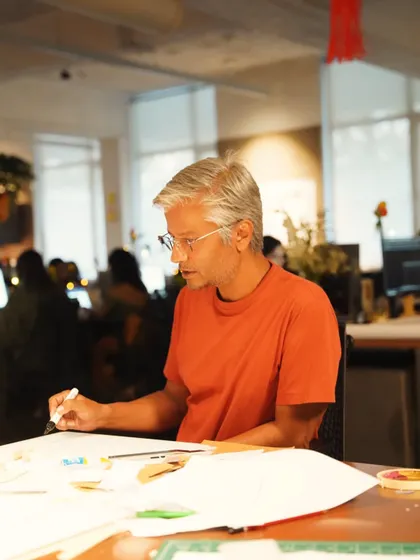 One of our senior designers sketching out ideas. The design process at Edifice is a blend of digital tools and traditional hand-drawing, ensuring that creativity and critical thinking are at the forefront.