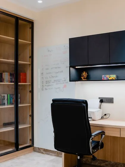 A close-up of one of the workstations in the study. The design is clean and minimalist, with a whiteboard on the wall for brainstorming and planning.