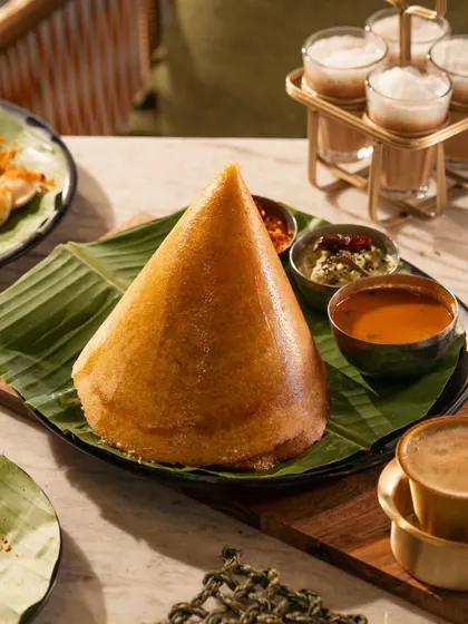 The iconic cone dosa, presented with its traditional accompaniments. I love shooting regional specialties, capturing their unique character and cultural significance.