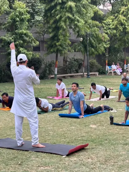 Leading a large outdoor class in Bhujangasana (Cobra Pose). Practicing in nature adds another layer of connection and tranquility to the yoga experience.
