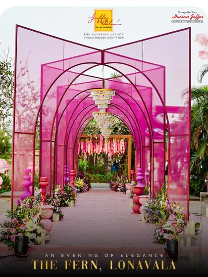 We bring our services to stunning locations like The Fern, Lonavala. This image shows the beautiful arched entryway of a wedding we catered, setting the tone for an evening of elegance.