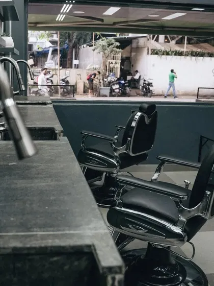 The view from the chair at Nomad Barber Mumbai. We designed the shop to be open and connected to the energy of the city.