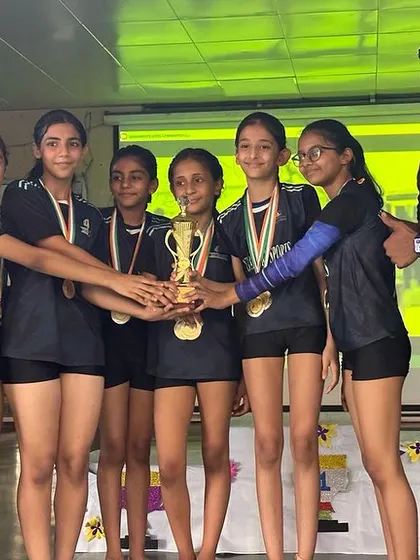 Our Level 4 Girls team with their Best Team award and their coach. A proud moment for everyone.