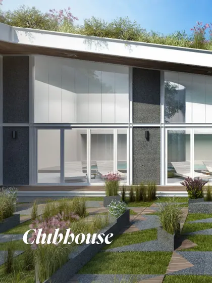 This render of the clubhouse facade highlights the integration of built and natural environments. Double-height glass walls blur the line between indoors and outdoors, while the green roof and landscaped pathways create a seamless spatial progression.