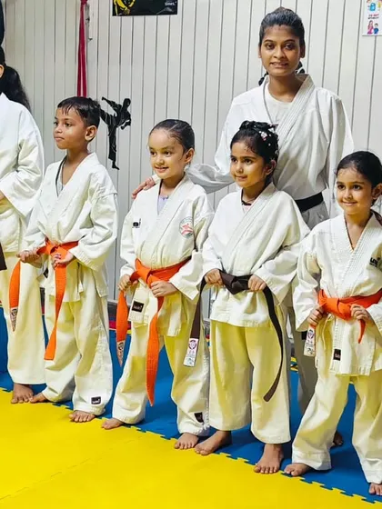 A group of our young students posing with their new belts. Belt promotions are an important milestone, marking their progress and achievements in karate.