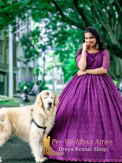 The purple lace ball gown, shown here with a furry friend, is perfect for creating sweet and memorable pre-wedding photos.