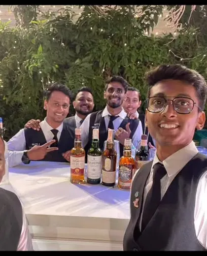 A team selfie from behind the bar. We are a team that enjoys what we do, and that positive energy translates into a better experience for your guests.