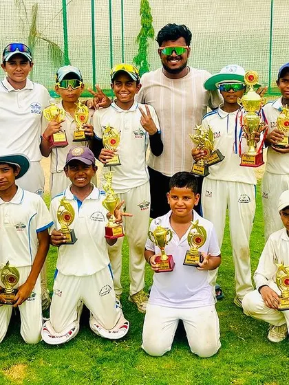The whole team together with their trophies. This picture captures the spirit and success of our academy.