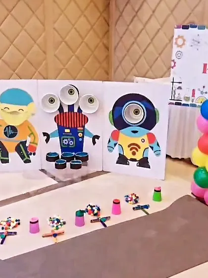 Our activity stations are set up and ready to go. Here, a monster-themed target game and robot-building materials await the party guests.