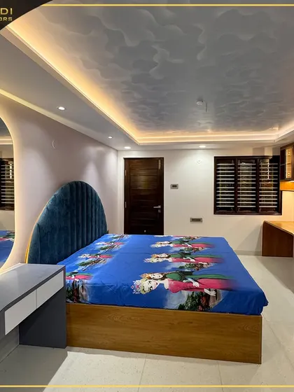 A wider view of the child's bedroom, showing the integrated study desks and shelving units on the side, all designed with a cohesive and playful aesthetic.